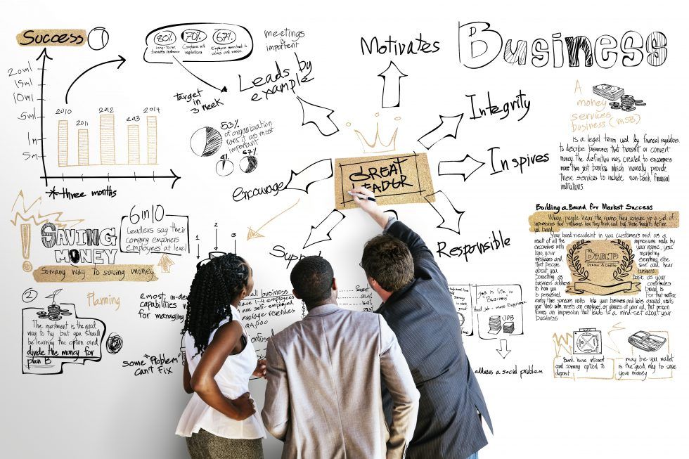 Founder and finance lead discussing questions in front of charts